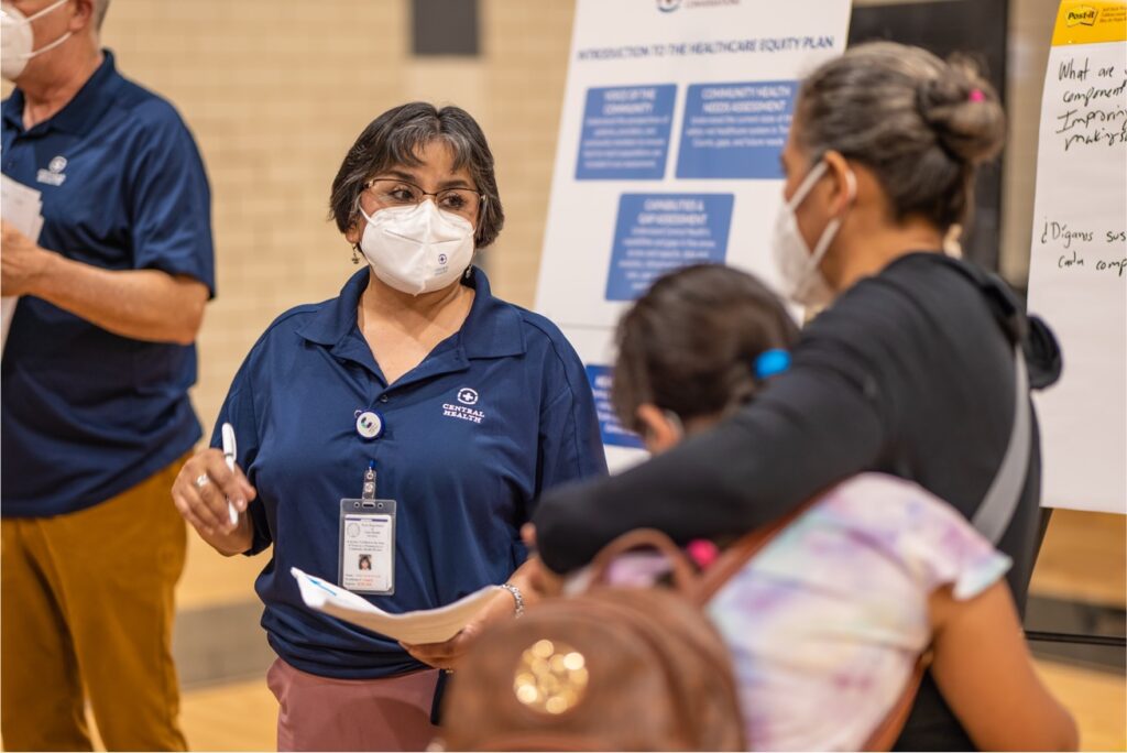 Central Health staff and community members at an outreach meeting